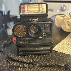 Polaroid Sonar OneStep Land Camera in Black and Gold